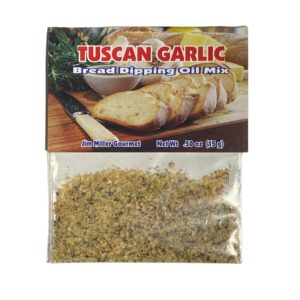 Tuscan garlic bread dipping oil mix seasoning packet with artisan bread slices, herbs, and savory Italian spice blend.